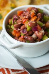 Peppers, onion, and a lime juice-spiked tomato sauce make this Caribbean Red Bean Salad anything but ordinary!