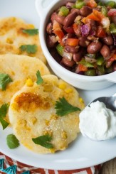 Melty cheddar cheese and sweet corn kernels add a special something to these Colombian Arepas!