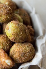 Deep Fried Olives: The perfect holiday appetizer! Just dip some drained olives in a beaten egg, coat with bread crumbs, and fry in olive oil. Make sure you have extra jars of olives on hand, because these will disappear quick!