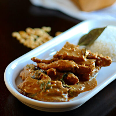 Beef Panang Curry on a plate served with rice.