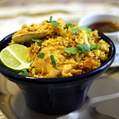 A bowl of Thai garlic chicken and rice.