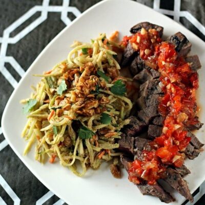 Crying Tiger Beef topped with vibrant red Thai relish.