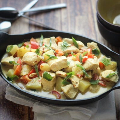 Slow Cooker Coconut Curry Chicken served in a black dish.