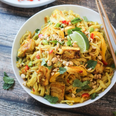 A bowl of tofu noodles stir fry.