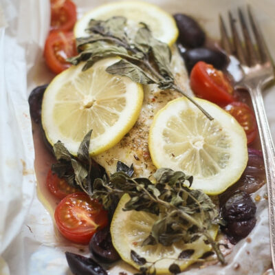 Greek Fish en Papillote wrapped in parchment paper for baking.