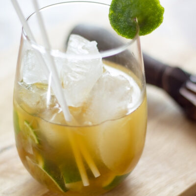 A clear glass with Brazilian Caipirinha.