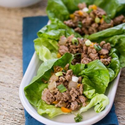 Asian turkey lettuce wraps arranged on a serving tray.