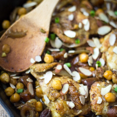 Moroccan chicken skillet served on a table.