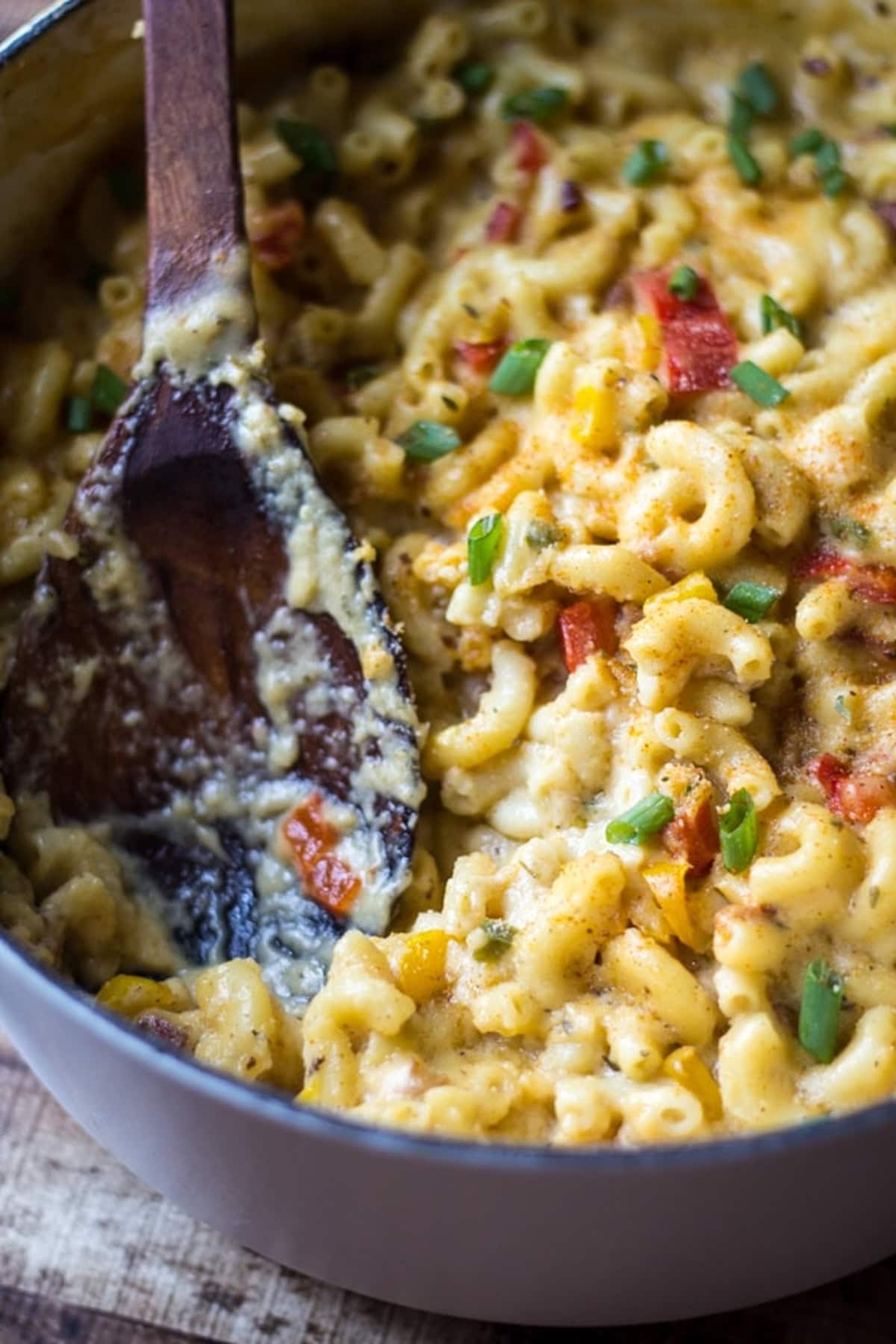 A top-down shot of Cajun bacon mac and cheese in a white pot.