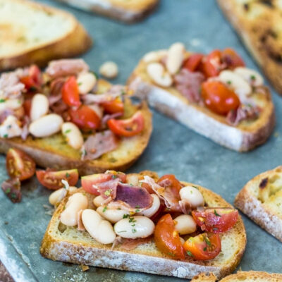 White bean bruschetta on toasted bread.