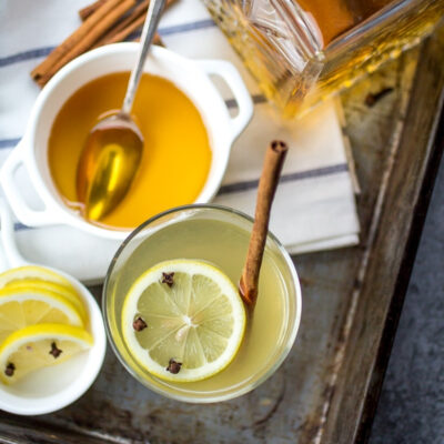 Hot rum toddy served in a glass.