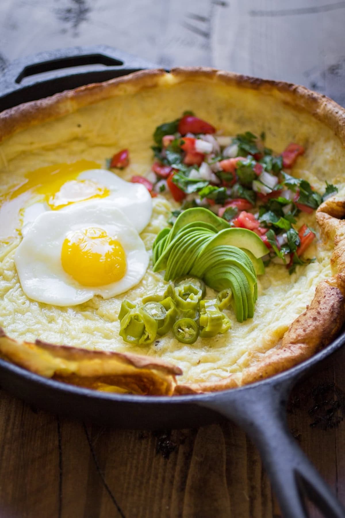 A Dutch Baby Breakfast Tex-Mex Style in a cast iron skillet.