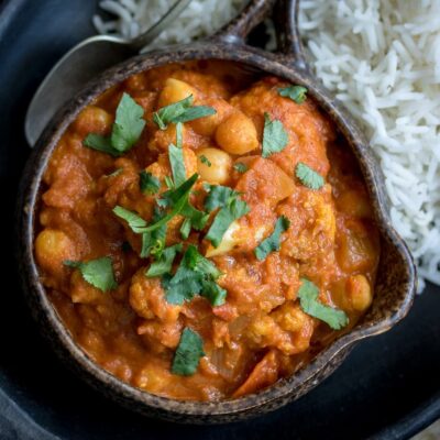 A serving of vegan Chickpea Tikka Masala and basmati rice.