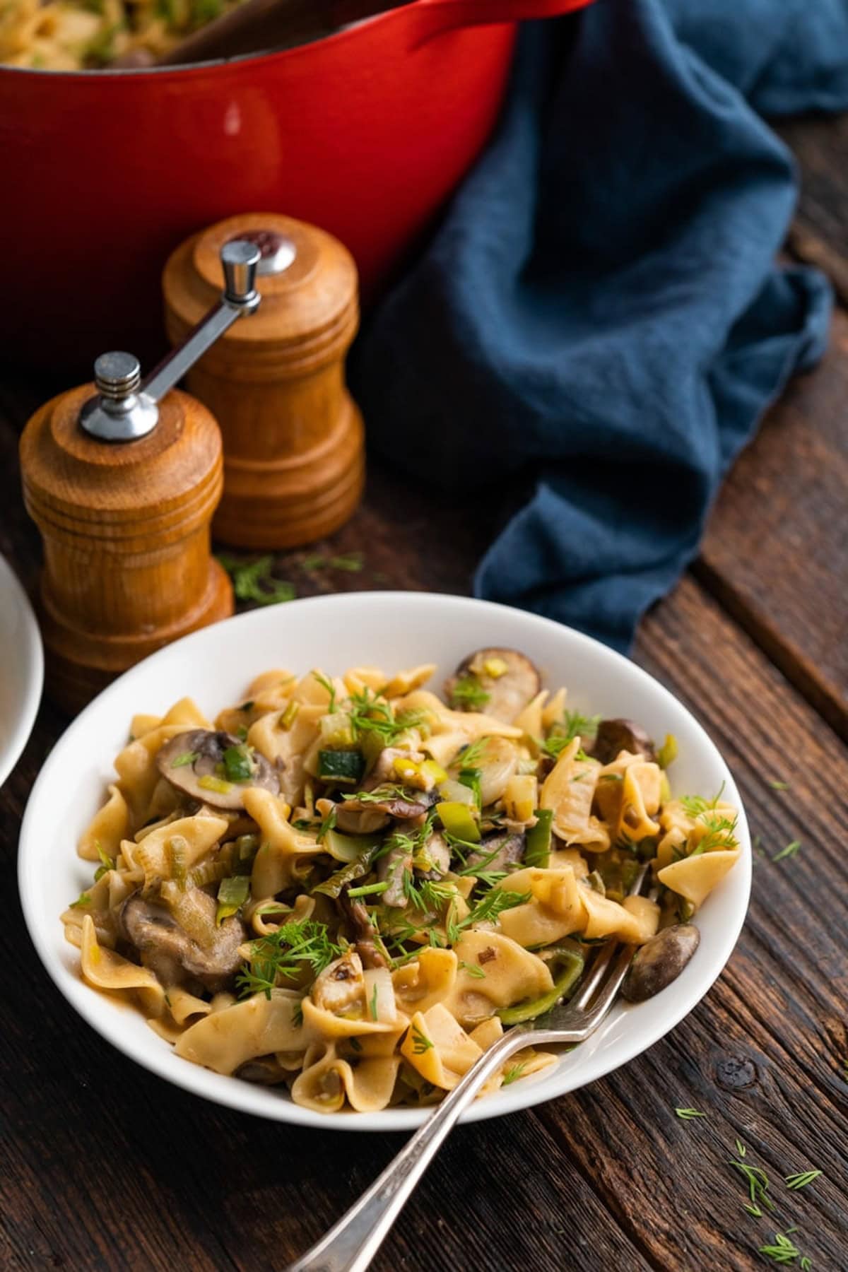 Vegan mushroom stroganoff on a wooden table.