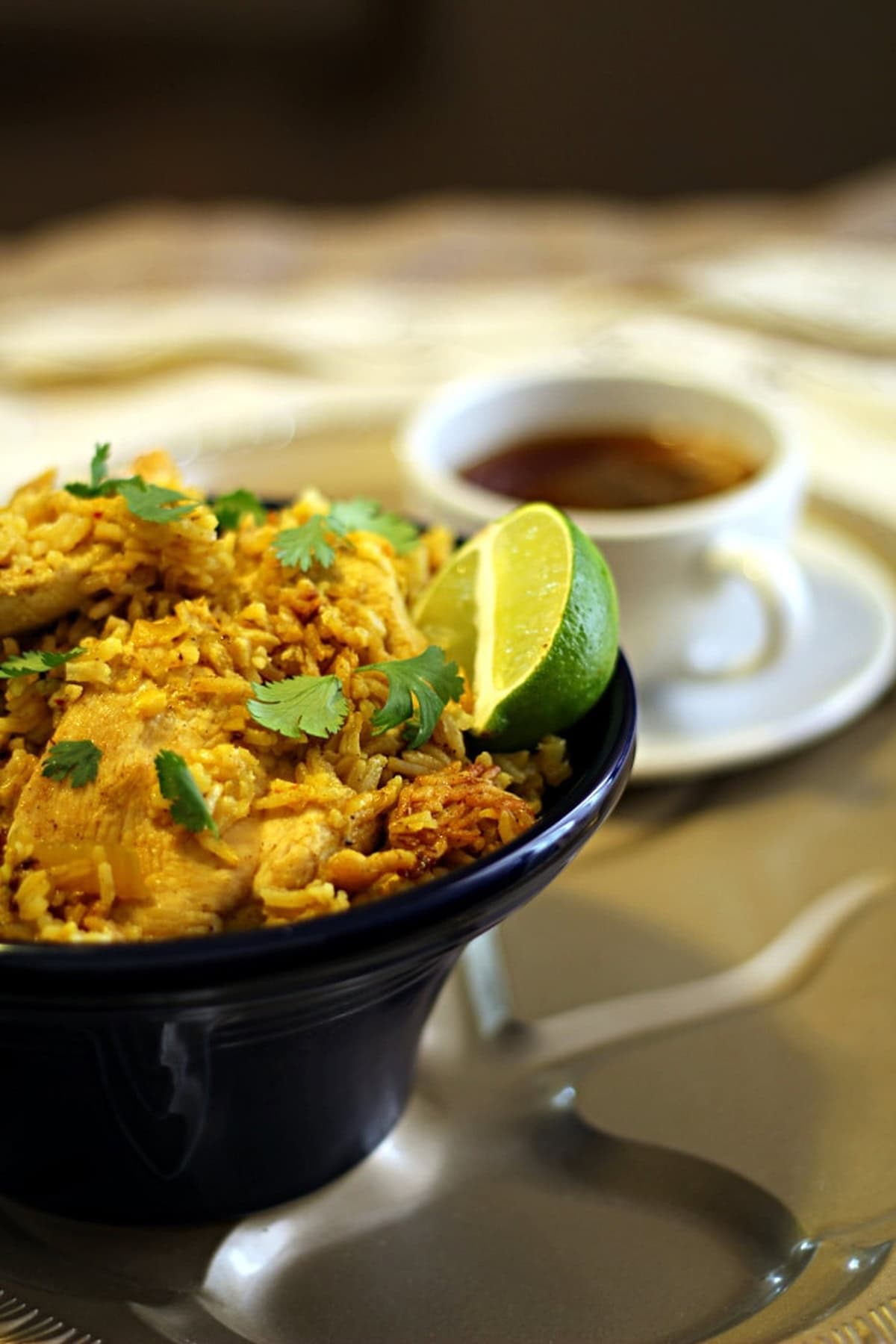 Close-up of Thai chicken and rice in a bowl.