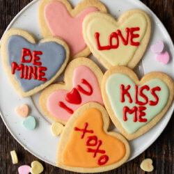 Brighten up your Valentine's Day with these fun and colorful Heart Cookies. Soft buttery sugar cookies topped with loving messages for everyone!