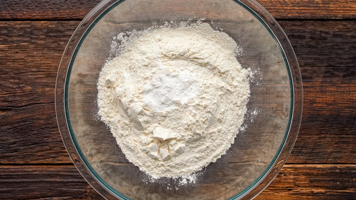Flour and baking powder in a glass bowl.