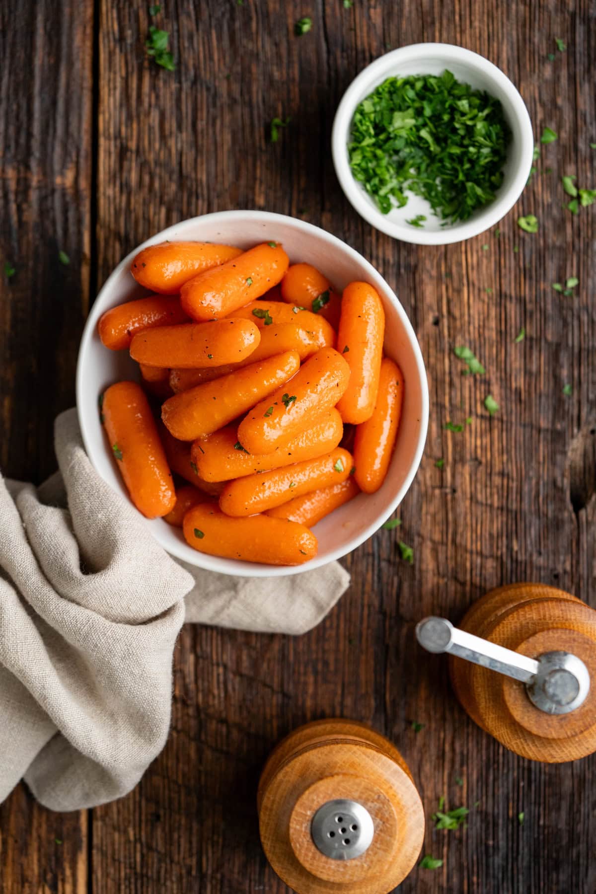 Serving of brown sugar carrots in a white bowl.
