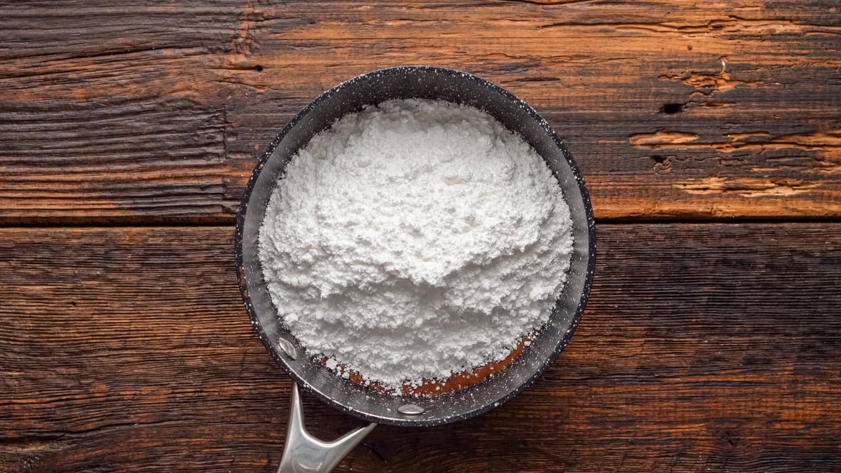 Powdered sugar added into the saucepan.
