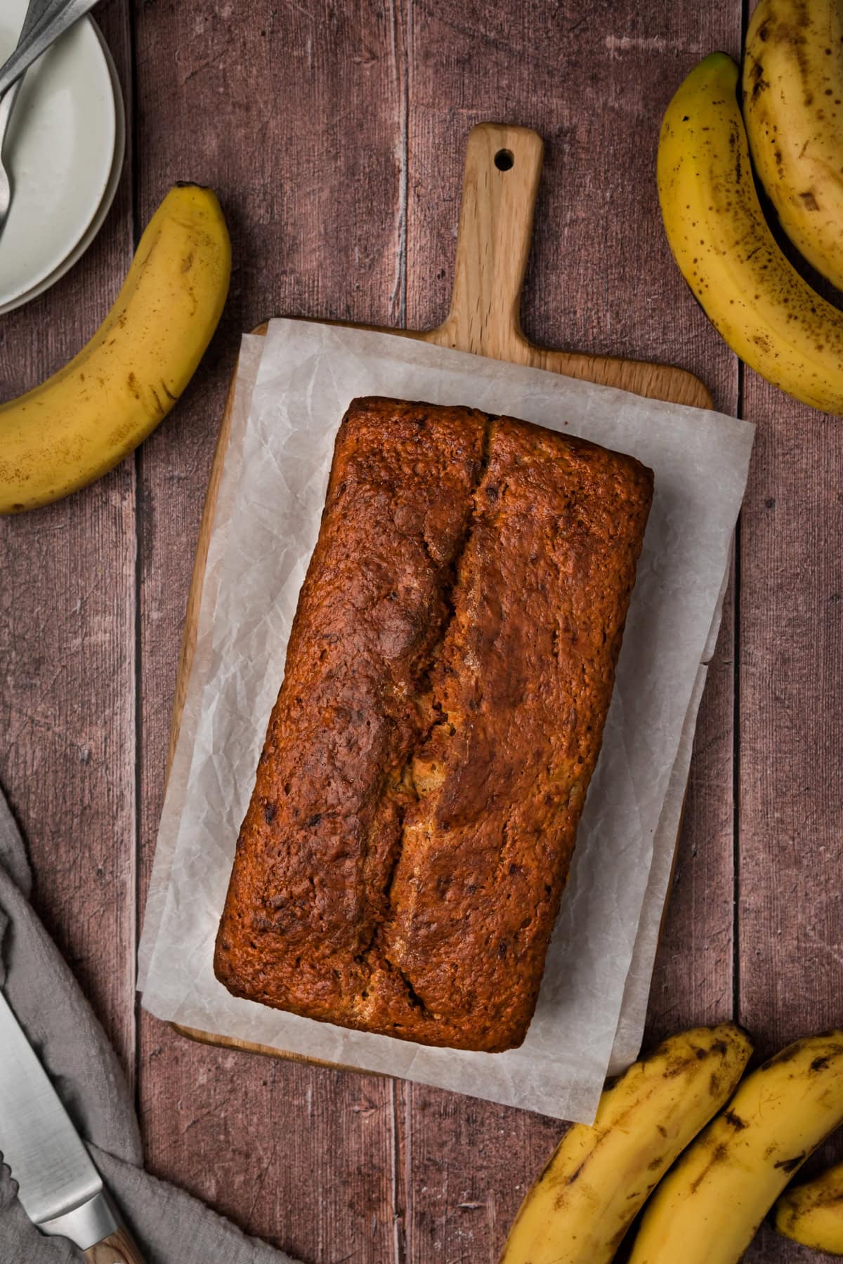 The best banana bread loaf on a cutting board.