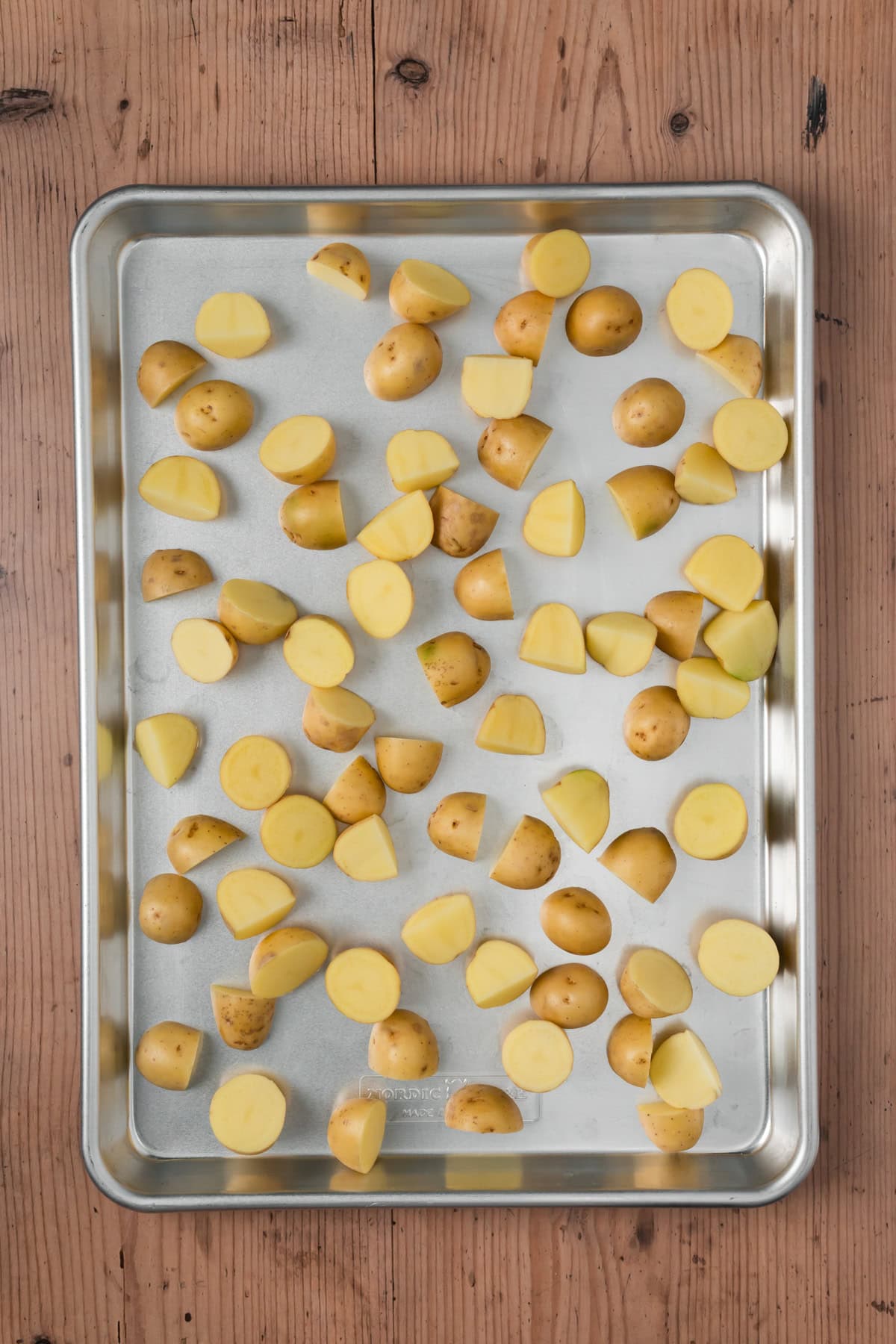 Potatoes on a baking sheet.