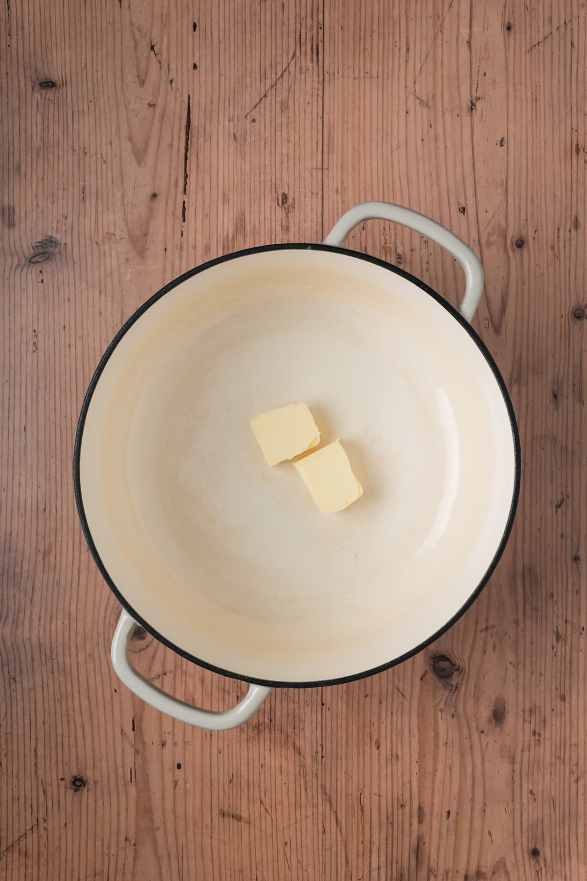 Butter in a pan.