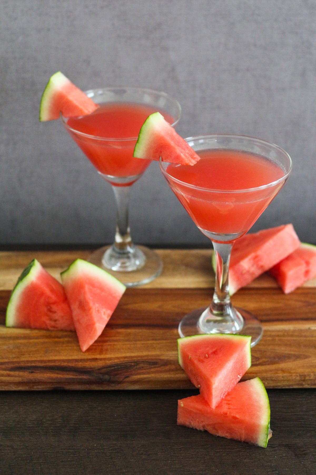Two watermelon martinis in martini glasses.