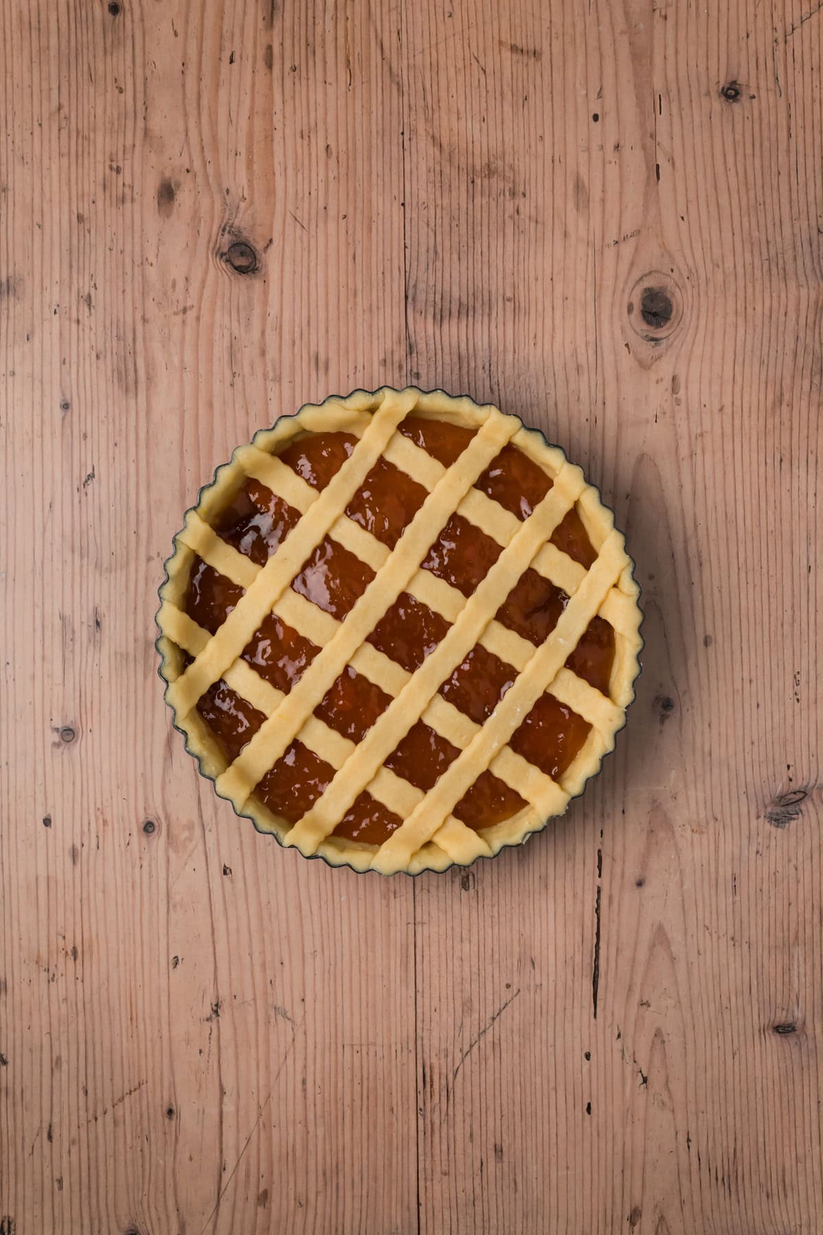 Lattice top dough placed over the top of the crostata.