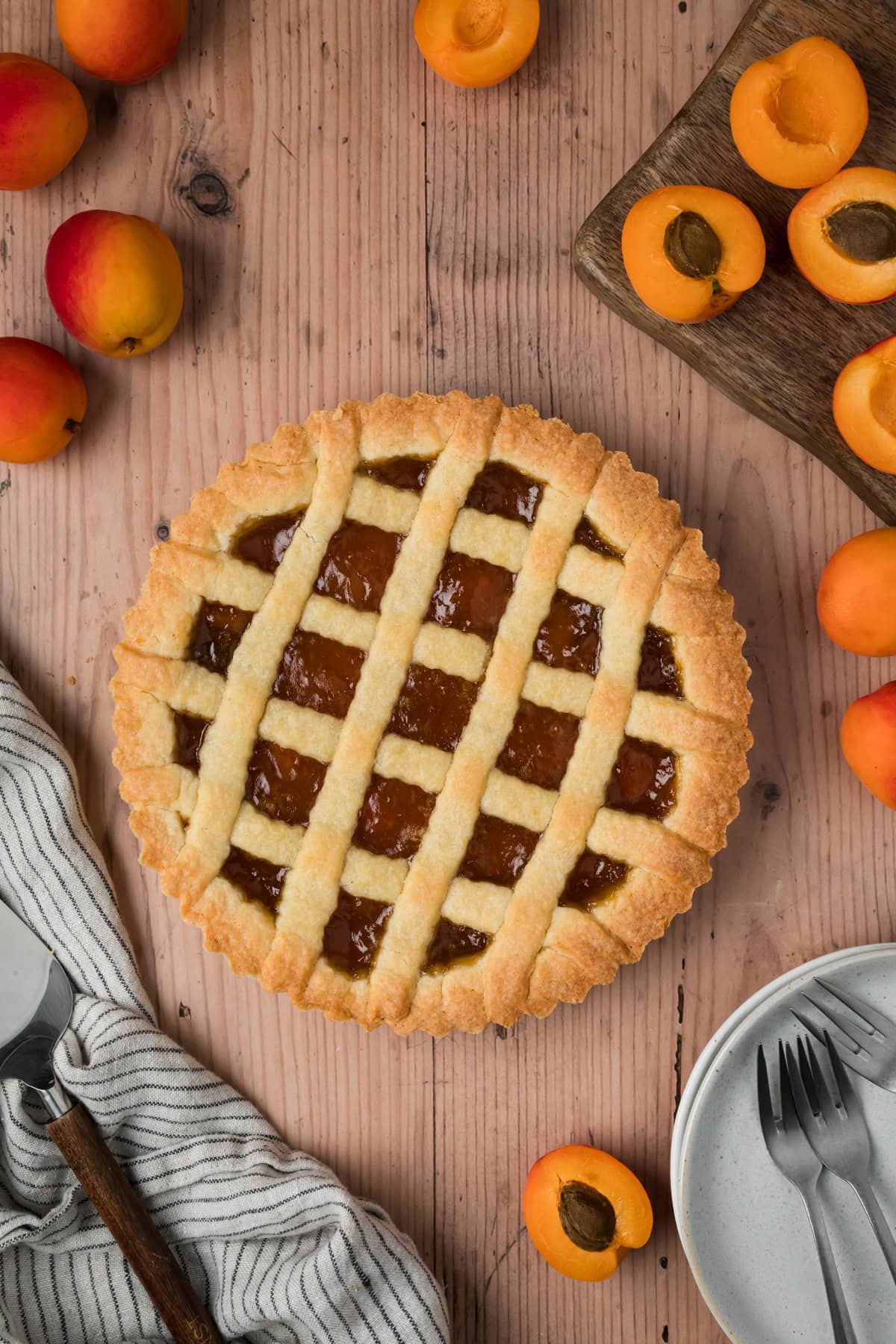 Baked crostata on a wooden table.