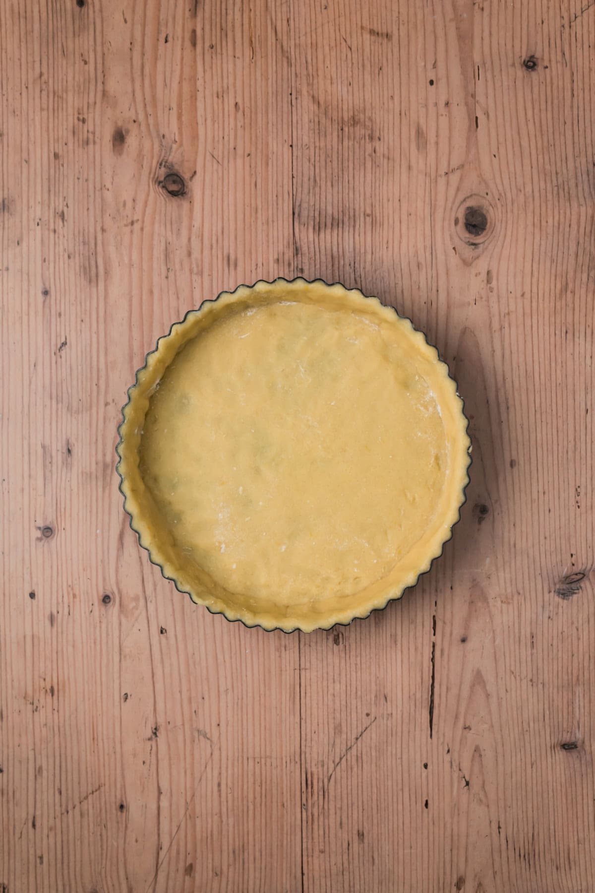 Tart dough rolled out and placed in the tart pan.