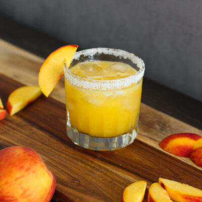 Fall in love with this fun and fruity Peach Margarita. It's juicy, tangy, and perfect for warm-weather sipping.