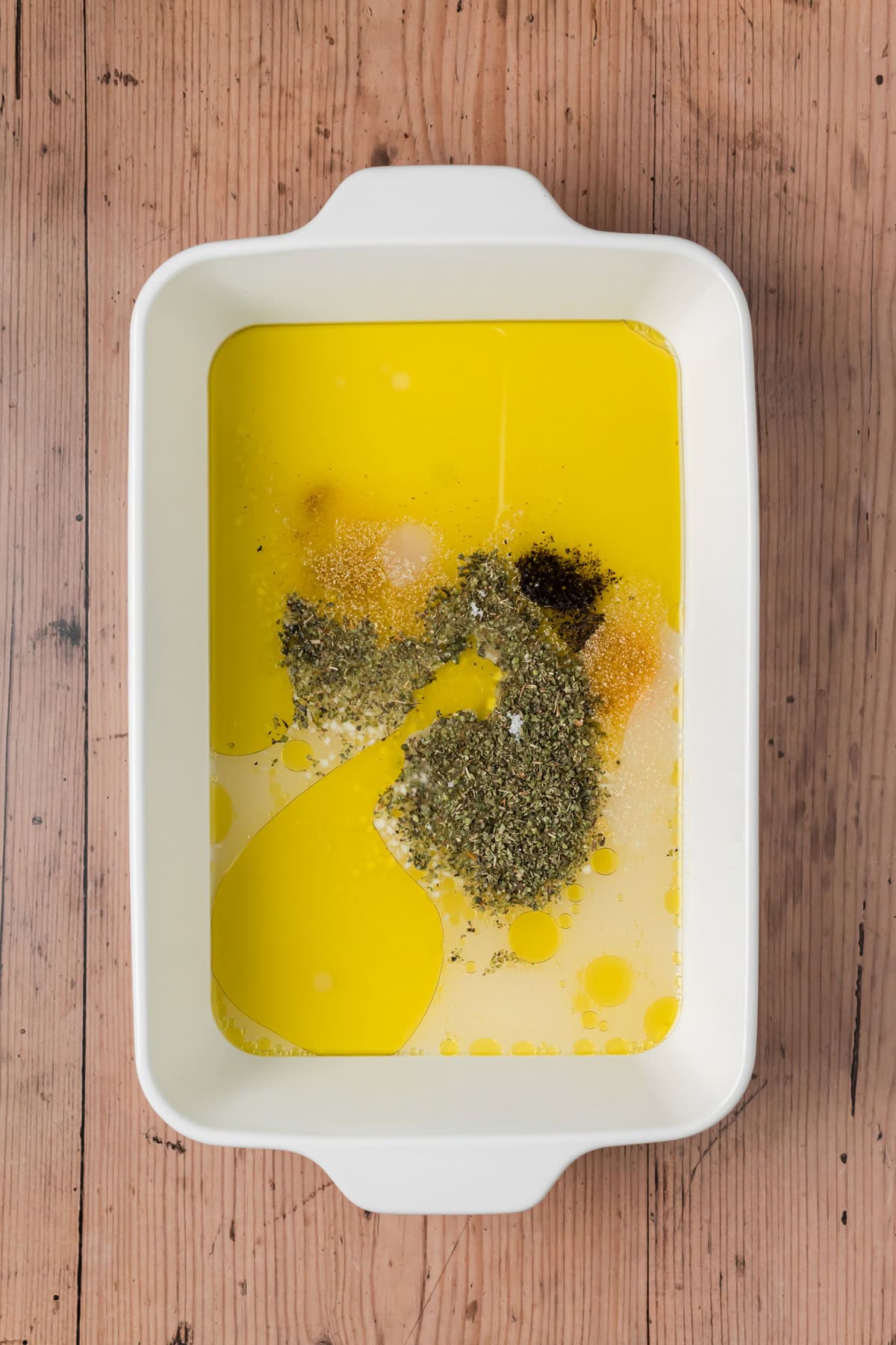 Liquid and spices in a baking dish.