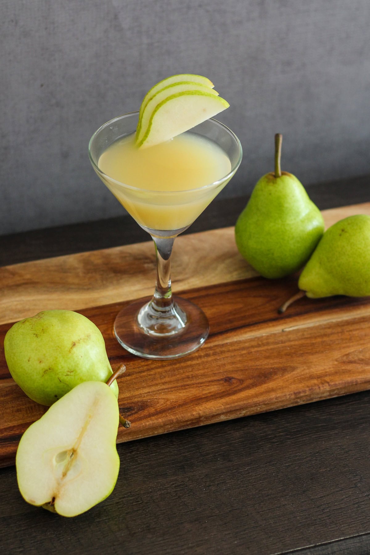 Pear martini garnished with pear slices.