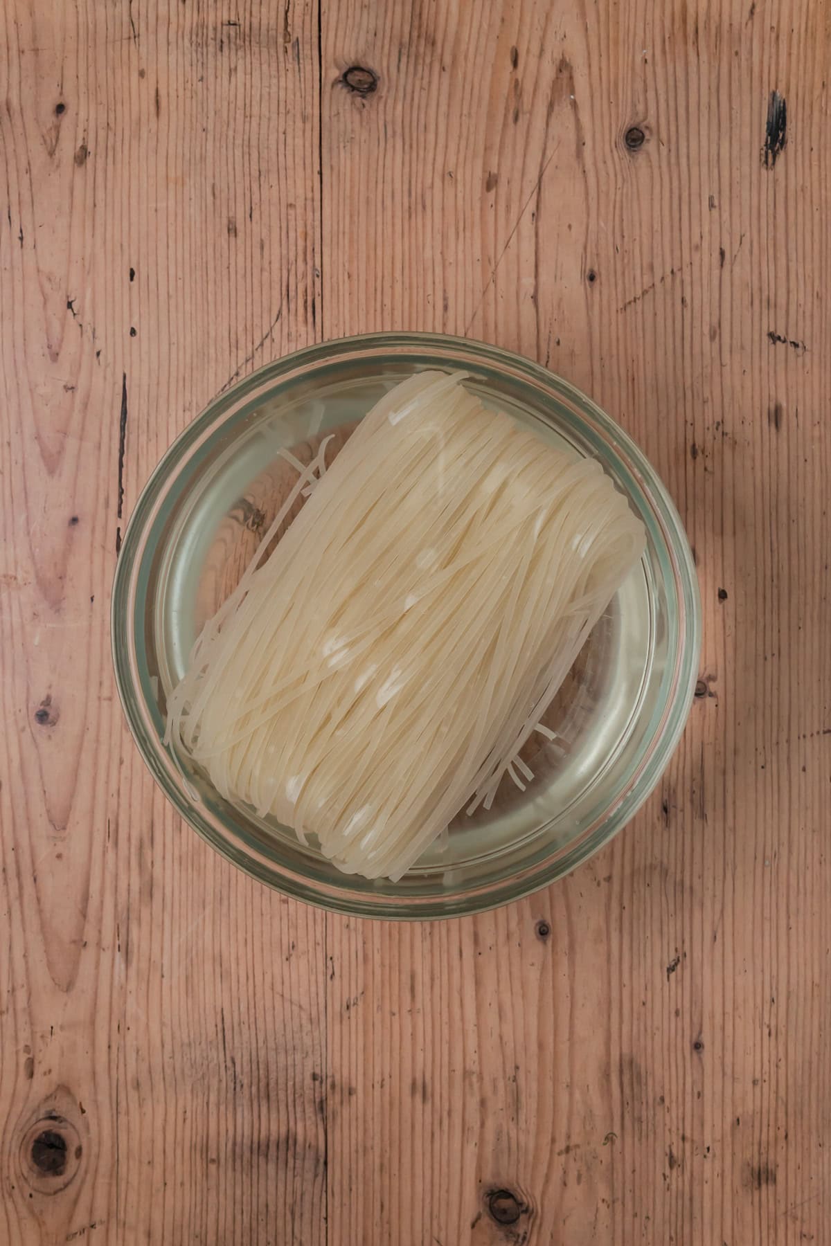 Rice noodles soaking in water.