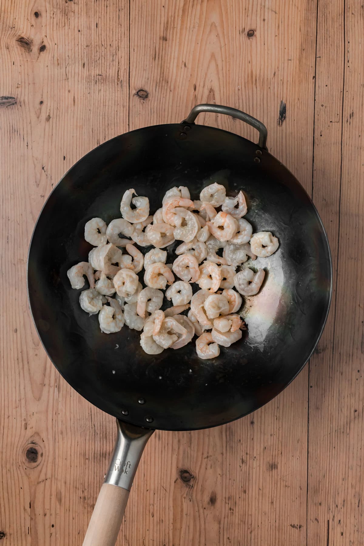 Shrimp cooking in a wok.